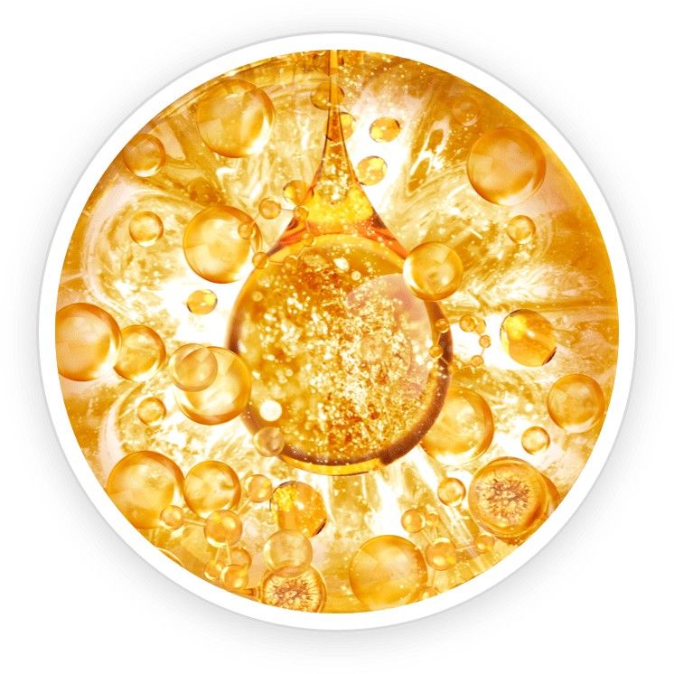 A bottle of clear mineral oil next to smooth stones and soft white towels, symbolizing moisture retention.