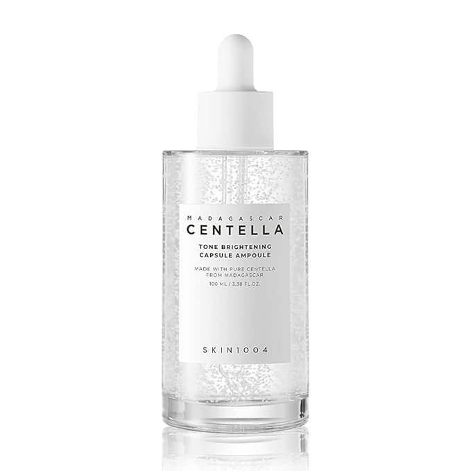 SKIN1004 Madagascar Centella Tone Brightening Capsule Ampoule bottle with clear serum and visible microbeads.